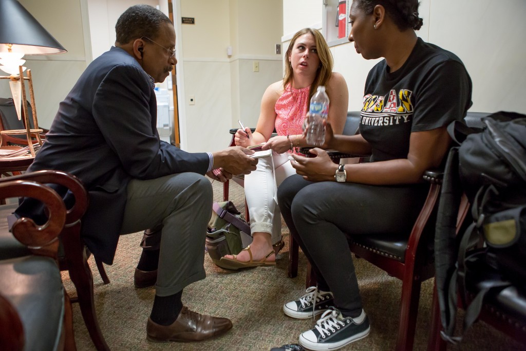 Morgan State University Professor Ron Taylor instructs MSU journalism student Maya Gilmore and WVU Reed College of Media student Kelsey Staggers in a story conference during the project in Selma. Photo by David Smith